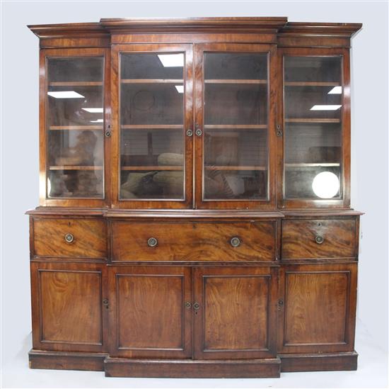 A George III mahogany breakfront secretaire bookcase, W.7ft 1in.